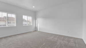 Unfurnished room featuring carpet flooring