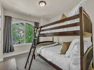 Bedroom with carpet floors and baseboards