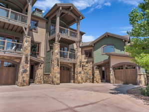 View of building exterior with driveway and a garage