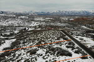 Snowy aerial view with a mountain view