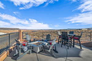 View of patio featuring a fire pit