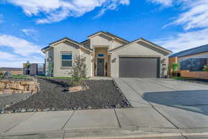 View of front of home featuring a garage