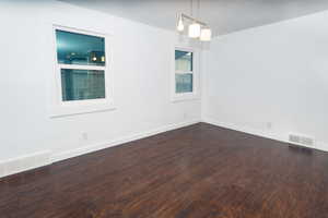 Empty room with wood-type flooring