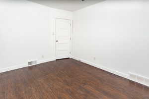 Unfurnished room with wood-type flooring