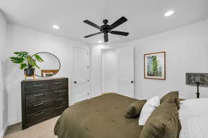 Bedroom featuring ceiling fan and light carpet