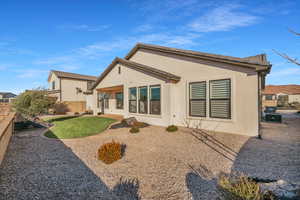 Rear view of property with a patio