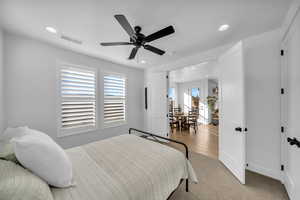 Bedroom featuring ceiling fan and light hardwood / wood-style flooring