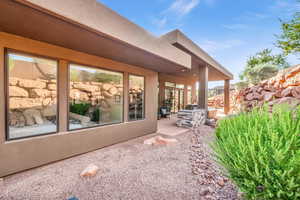 View of side of home featuring a patio