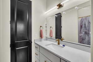 Bathroom with vanity and walk in shower