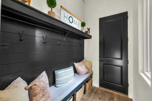 Mudroom featuring dark wood-type flooring