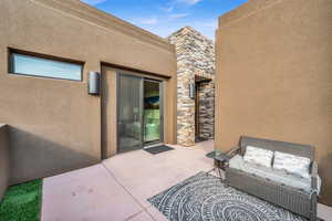 View of patio featuring an outdoor hangout area