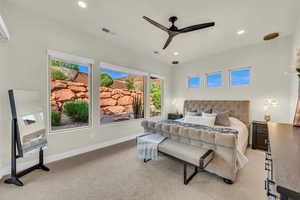 Bedroom with light carpet and ceiling fan