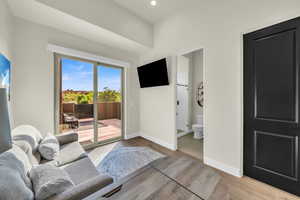 Living room with light hardwood / wood-style flooring