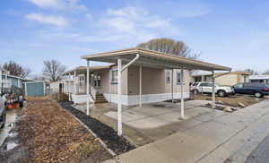 View of front of home with a carport