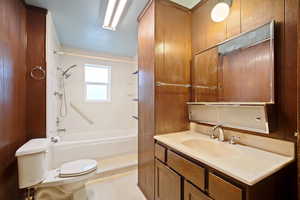 Full bathroom featuring  shower combination, toilet, and vanity