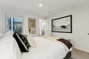 Bedroom featuring ornamental molding and carpet