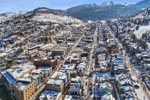 Snowy aerial view with a mountain view