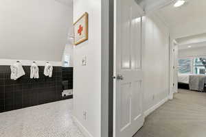 Hallway featuring ornamental molding