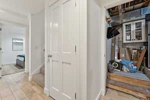 Hallway with light hardwood / wood-style floors