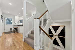 Stairs with hardwood / wood-style flooring