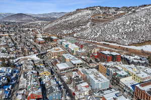 Snowy aerial view with a mountain view