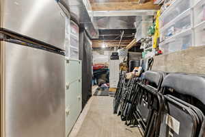 Basement with stainless steel refrigerator