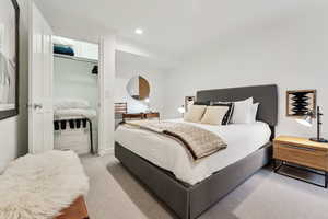 Bedroom featuring light carpet and crown molding