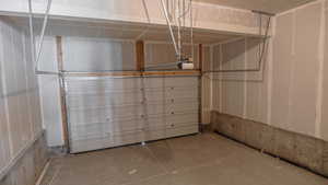 Garage featuring a garage door opener