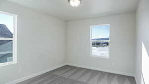 Unfurnished room with carpet floors