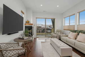 Living room with a mountain view and hardwood / wood-style floors