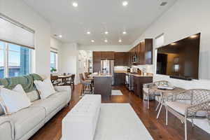 Living room with dark hardwood / wood-style floors