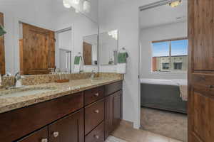 Bathroom featuring vanity and tile patterned flooring