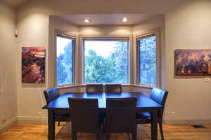 Dining area with light hardwood / wood-style floors