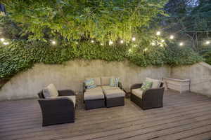 Wooden terrace featuring outdoor lounge area