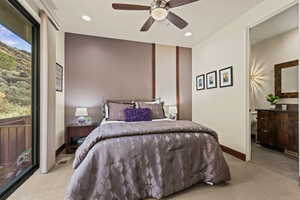 Carpeted bedroom with ceiling fan