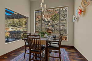 Dining room featuring dark wood-type flooring