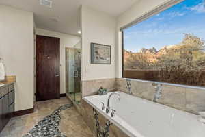 Bathroom with vanity, a mountain view, and plus walk in shower