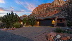 View of front of home featuring a garage and a mountain view