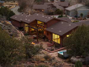 Back of property featuring central AC and a patio area