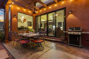 View of patio with a pergola and grilling area