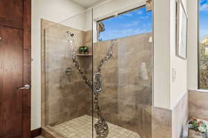 Bathroom featuring a shower with shower door