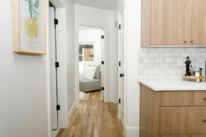 Hallway featuring light wood-type flooring