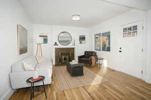 Main home front room, amazing hardwood floors throughout.