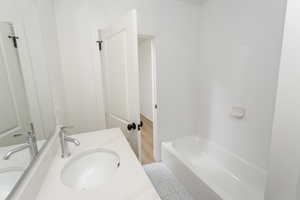 2nd home Bathroom featuring new vanity and new bathing tub / shower combination