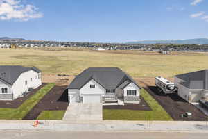 Birds eye view of property with a mountain view