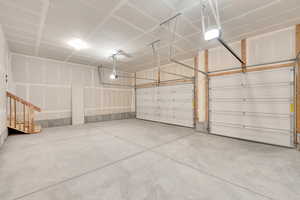 Garage featuring a garage door opener