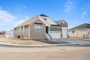 View of front of home with cooling unit