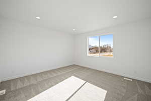 Empty room featuring carpet floors