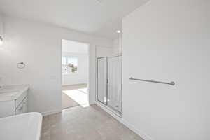 Bathroom with an enclosed shower and vanity