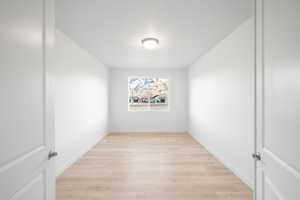 Empty room featuring light hardwood / wood-style flooring